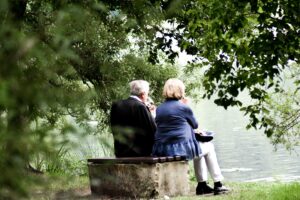 Elderly-Couple-Safely-On-Bench